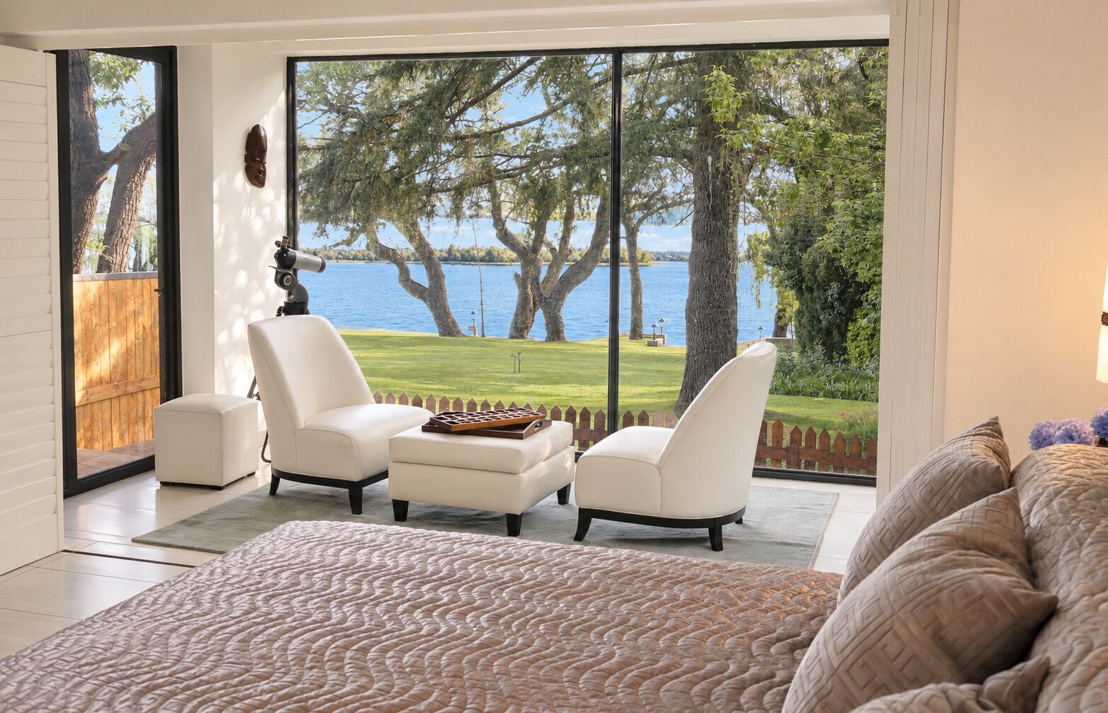 The Executive Suite: Two armchairs at a floor-to-ceiling window, looking over the lawn to the Vaal River